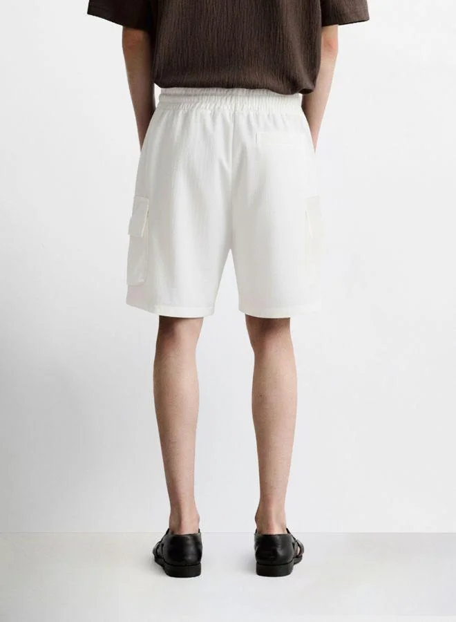 The Indian Garage Co Men Relaxed Fit Solid Cargo Pocket Mid-Rise Cargo Shorts
